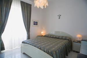 Postel nebo postele na pokoji v ubytování Villa Natalina
