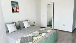 A bed or beds in a room at Guest House Pomorie