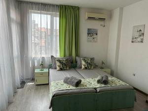A bed or beds in a room at Guest House Pomorie