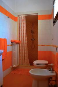 a bathroom with a shower with a toilet and a sink at I due Tesori in San Cesario di Lecce