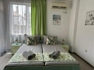 A bed or beds in a room at Guest House Pomorie