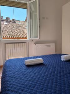 Posteľ alebo postele v izbe v ubytovaní Bologna Apartment