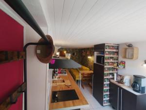 a small kitchen with a table in a room at Studio Athena in Aix-les-Bains