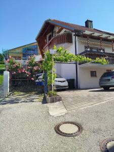 a house with a car parked in front of it at Ferienwohnung am Hang in Ettenheim