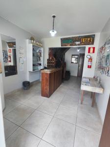 a room with a tile floor and a counter in a store at Pousada Acayaca in Diamantina