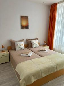 A bed or beds in a room at Guest House Pomorie