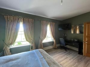 Postel nebo postele na pokoji v ubytování Esker Lodge
