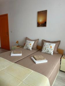 A bed or beds in a room at Guest House Pomorie