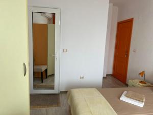 A bed or beds in a room at Guest House Pomorie