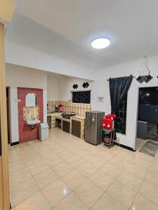 a room with a bathroom with a sink and a mirror at Villa STS Cisarua Puncak in Cisarua