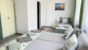 A bed or beds in a room at Guest House Pomorie