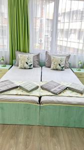 A bed or beds in a room at Guest House Pomorie