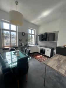 a kitchen and dining room with a table and chairs at Große Ferienwohnung Limburg Diez in Diez