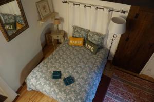 a small bedroom with a bed with a pillow on it at Albizia in La Redorte