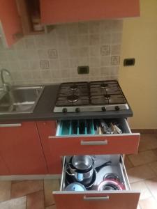 a kitchen with a stove and a sink at Casa del dottore in Cefalù +27 photos