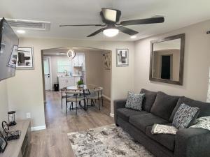 a living room with a couch and a table at Mae's Place in Savannah