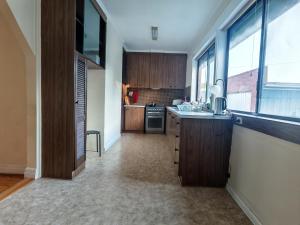 a kitchen with a sink and a counter top at Free Parking 5min Walk to Asian Supermarket Family Room Deakin Uni Quiet Camberwell in Camberwell