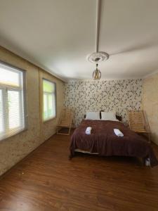 Postel nebo postele na pokoji v ubytování Guest House AKU'TSA