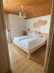 Postel nebo postele na pokoji v ubytování Garni Neidia