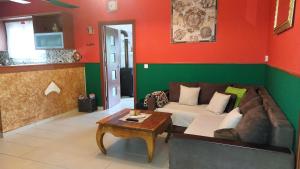 a living room with a couch and a table at Stamyra House in Liapades