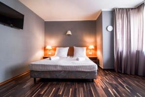 Cama ou camas em um quarto em Villa ENTO HotelWestEnd