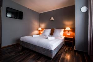 Cama ou camas em um quarto em Villa ENTO HotelWestEnd