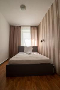 Cama ou camas em um quarto em Villa ENTO HotelWestEnd