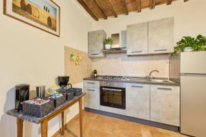 Kuchyň nebo kuchyňský kout v ubytování Appartamento Athena-Montepulciano House