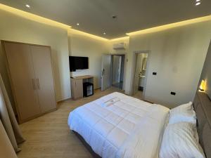 Postel nebo postele na pokoji v ubytování Hotel Tuyo