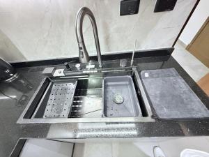 a sink in a kitchen with a sink at madintay b8 modern cozy studio in Madinaty +47 photos