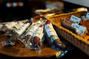 a group of wrapped hot dogs on a table at Heidi's Guesthouse in Frenières +35 photos