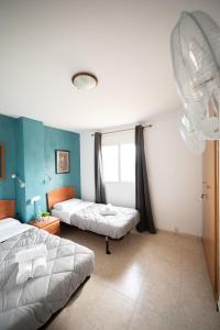 Postel nebo postele na pokoji v ubytování Apartalux Magic Paradise