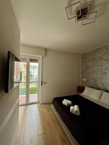 Televízia a/alebo spoločenská miestnosť v ubytovaní san rocco apartments