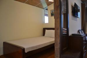 Postelja oz. postelje v sobi nastanitve West End Lodges