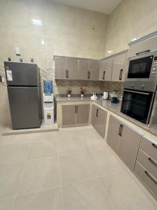 Kuchyň nebo kuchyňský kout v ubytování منزل لافيدا La Vida Home