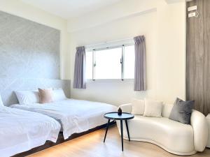Een bed of bedden in een kamer bij 沙沙民宿