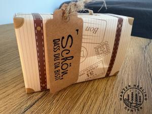 two books sitting on top of a wooden table at HARZER HEALING CENTER 2025 Himmlische Landhauswohnung mit Fussbodenheizung,XXL Kochinsel,XXL Regendusche,Modern,Hochwertig,Persönlich,Vollausgestattet in Elbingerode +12 photos