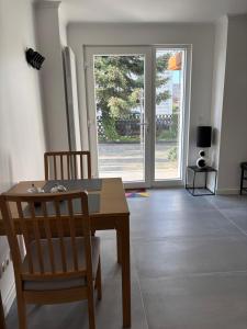a dining room with a table and two chairs at FeWo Mona in Kruft
