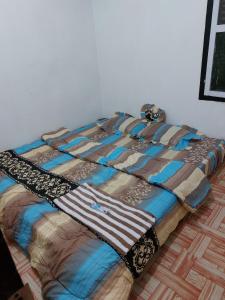 Ένα ή περισσότερα κρεβάτια σε δωμάτιο στο ZZIP Homestay