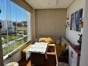 a living room with a couch and a table at Mirador Capo Negro in Cabo Negro