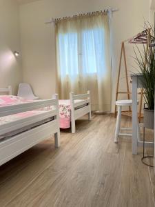 Postel nebo postele na pokoji v ubytování Kontos Mansion
