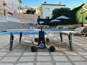 a table tennis racket sitting on a patio at Hostal San Telmo - Adults Only in Palma de Mallorca