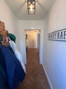 a hallway of a room with a no rise rate sign at Comfy Ballymoney Base in Ballymoney