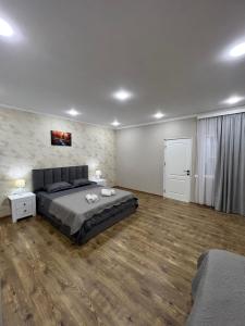 Postel nebo postele na pokoji v ubytování Home in Tiflis