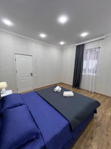 Postel nebo postele na pokoji v ubytování Home in Tiflis + 11 fotografií