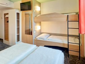 Postel nebo postele na pokoji v ubytování B&B Hotel Aschaffenburg + 22 fotografií