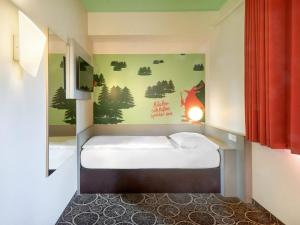 Postel nebo postele na pokoji v ubytování B&B Hotel Aschaffenburg
