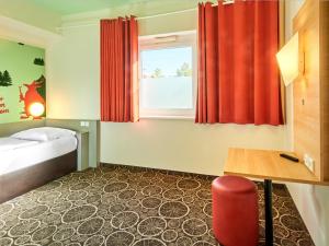 Postel nebo postele na pokoji v ubytování B&B Hotel Aschaffenburg