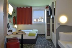 Postel nebo postele na pokoji v ubytování B&B Hotel Aschaffenburg