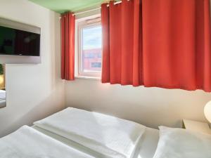 Postel nebo postele na pokoji v ubytování B&B Hotel Aschaffenburg